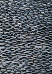 Wall of smooth pebbles.