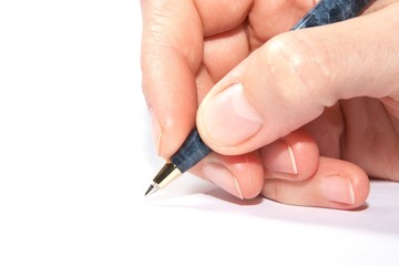 Hand holding a marbled pen