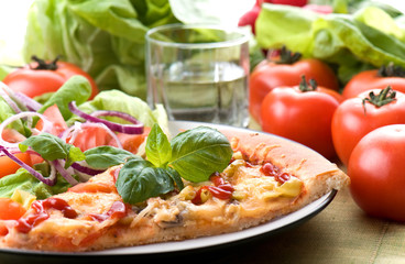 Pizza with pesto sauce and cheese