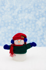 Snowman on snow with snowflake background, merry Christmas