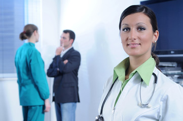 Young doctor and staff of hospital