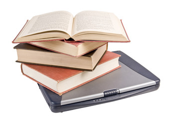 small stack of books on a laptop