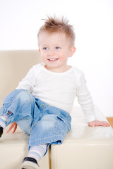 Portrait of 2 years old happy baby boy, smiling.