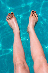 femails foots in pool - water