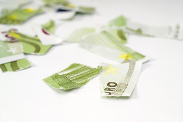 Ripped euro banknote on white background.