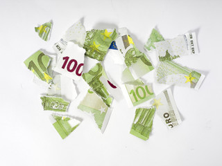 Ripped euro banknote on white background.