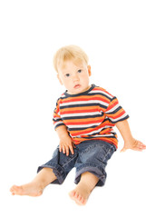 Beautiful child sitting. Isolated on white background