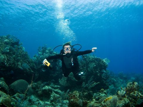 Diver smiling underwater on a Caribbean Reef