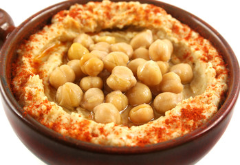 Earthenware bowl with delicious hommus and chickpeas