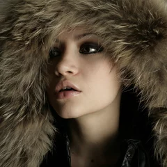 Foto op Canvas Fashion portrait of young pretty woman with fur © Egor Mayer