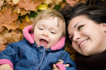 mother and daughter playing in park