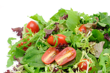 Background of salad leaves and cherry tomatoes with copyspace