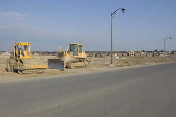 Truck, new houses and house's construction sites