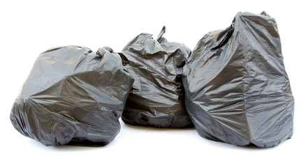 Three black garbage bags isolated on a white background