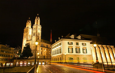 Fototapeta premium The Grossmunster Cathedral in Zurich Switzerland at night