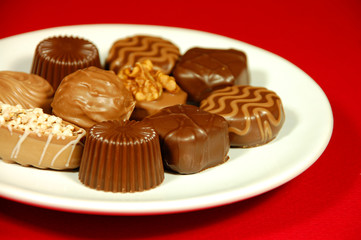 Assorted chocolates on white plate