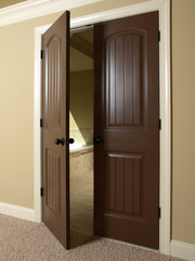 Open Double Dark Wood Door to Bathroom