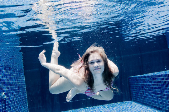 An underwater shot of a woman in a swimming pool