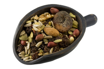 rustic, wooden scoop of trail mix, isolated