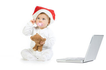 Baby sat with laptop computer