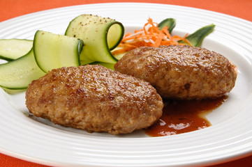 Fried steaks with vegetable salad