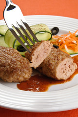 Fried steaks with vegetable salad