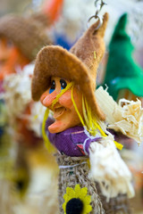 Close up of a small puppet representing a witch