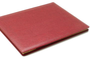 Sold agenda with leather cover on a white background