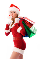 beautiful girl dressed like Santa with Christmas presents