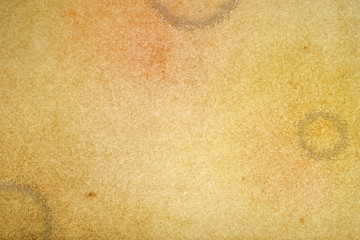 Grunge paper as background with stain of coffee