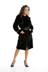 Fototapeta premium Young attractive woman in fur coat