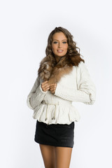Young attractive woman in fur coat