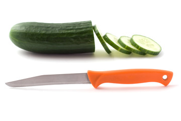 Sliced cucumber and knife on white background
