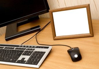 Empty photo frame on computer table