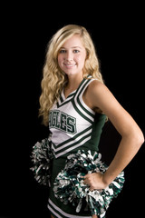 beautiful blond cheerleader with pom pons over black
