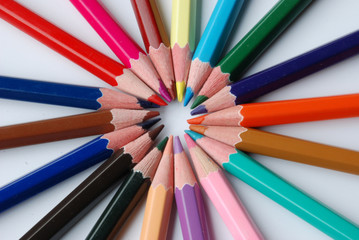Naklejka premium Assortment of coloured pencils with shadow on white background
