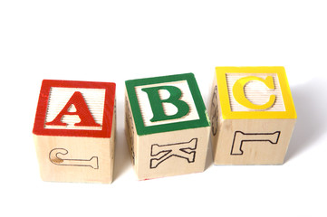 wooden ABC blocks on a white background