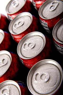 Cans of ice cold red soda pop in aluminum cans