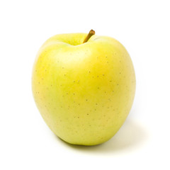 Yellow apple on white background with shadows