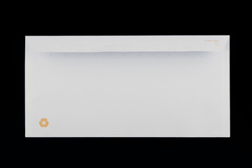 back of a white envelope isolated on black background