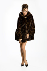 Young attractive woman in fur coat