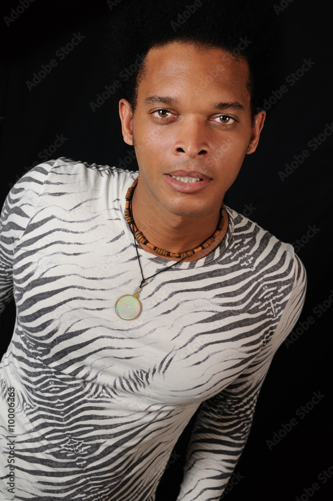 Wall mural Portrait of young trendy african male model with attitude