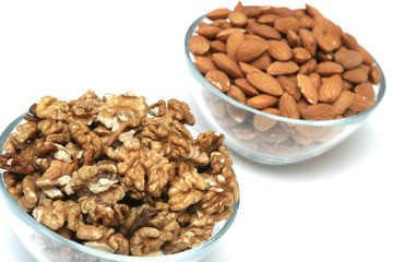 Walnuts and almonds on a white background