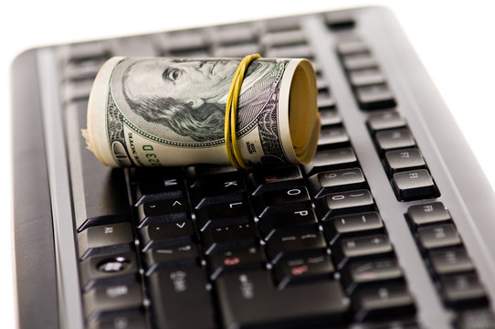 Money Roll Over Computer Keyboard