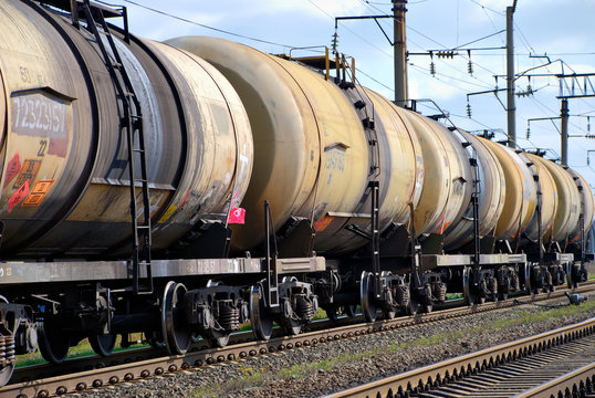 Fototapeta The train transports tanks with oil and fuel