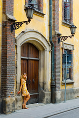 Fototapeta na wymiar Woman on the ancient street in Krakow