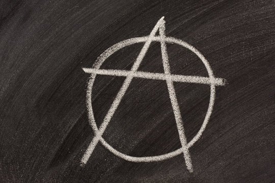 symbol for anarchy on a blackboard