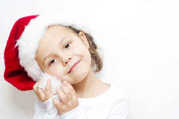 little girl dressed like a santa claus