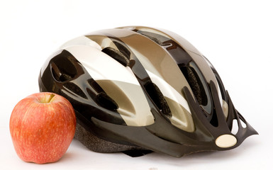 Fototapeta premium Bicycle helmet and apple