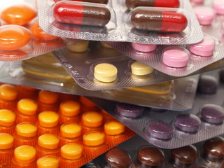 A few blister packages with colorful pills